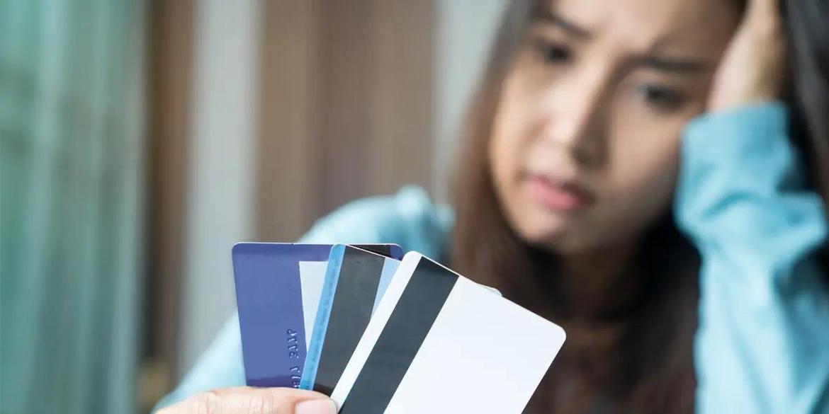 Young Female with Multiple Credit Cards