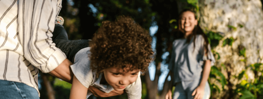 child playing with parents