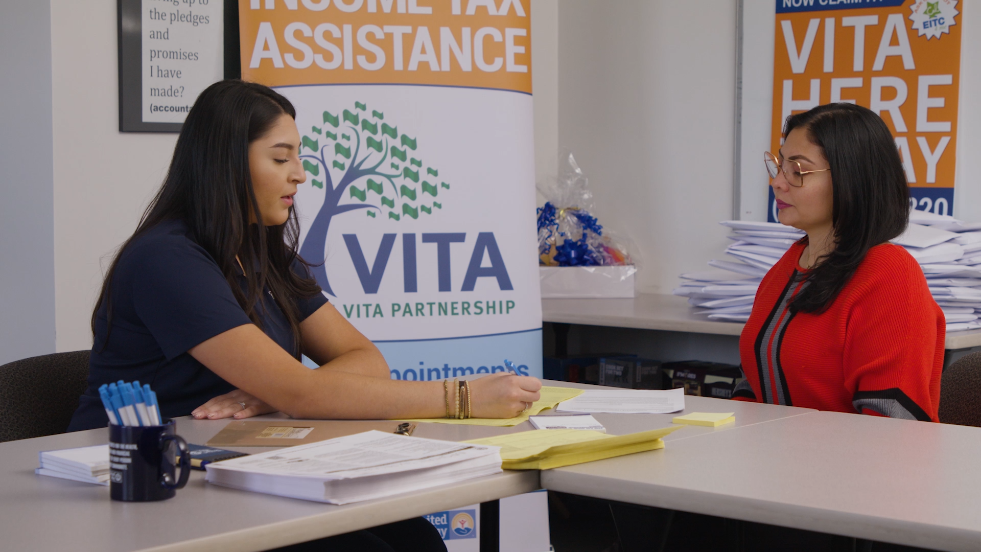 VITA volunteer helping a client