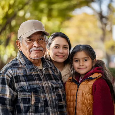 A hispanic family, two adults and a child.