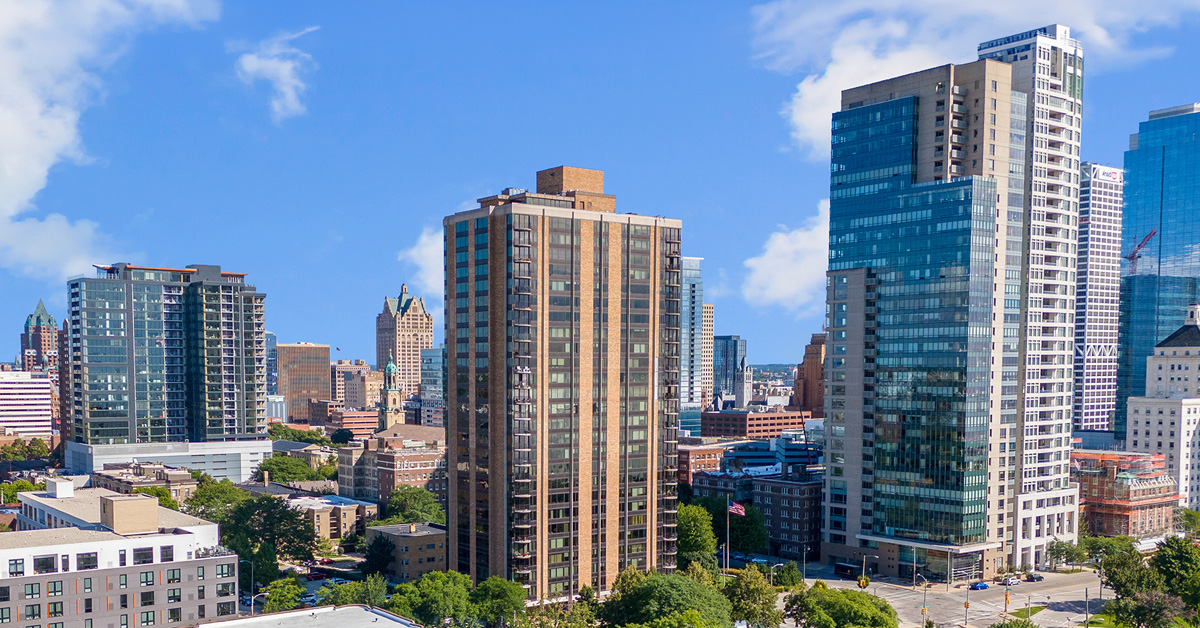 The skyline of a large city against a bright sunny day.